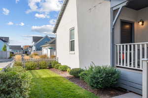 View of property exterior featuring stucco siding and a residential view