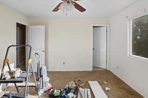 Unfurnished bedroom with carpet and ceiling fan