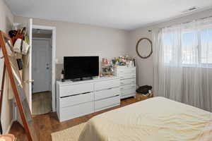 Bedroom featuring dark wood-style floors