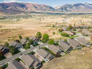 View of property location featuring nearby suburban area and a mountainous background