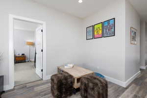 Dining space featuring wood finished floors and recessed lighting