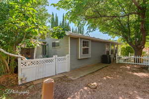View of side of home featuring a central air condition unit