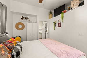 Bedroom with a ceiling fan and a closet