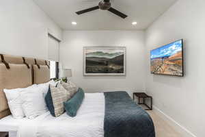 Bedroom with carpet floors, ceiling fan, and recessed lighting