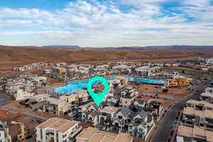 Drone / aerial view of a pool area and a mountain backdrop