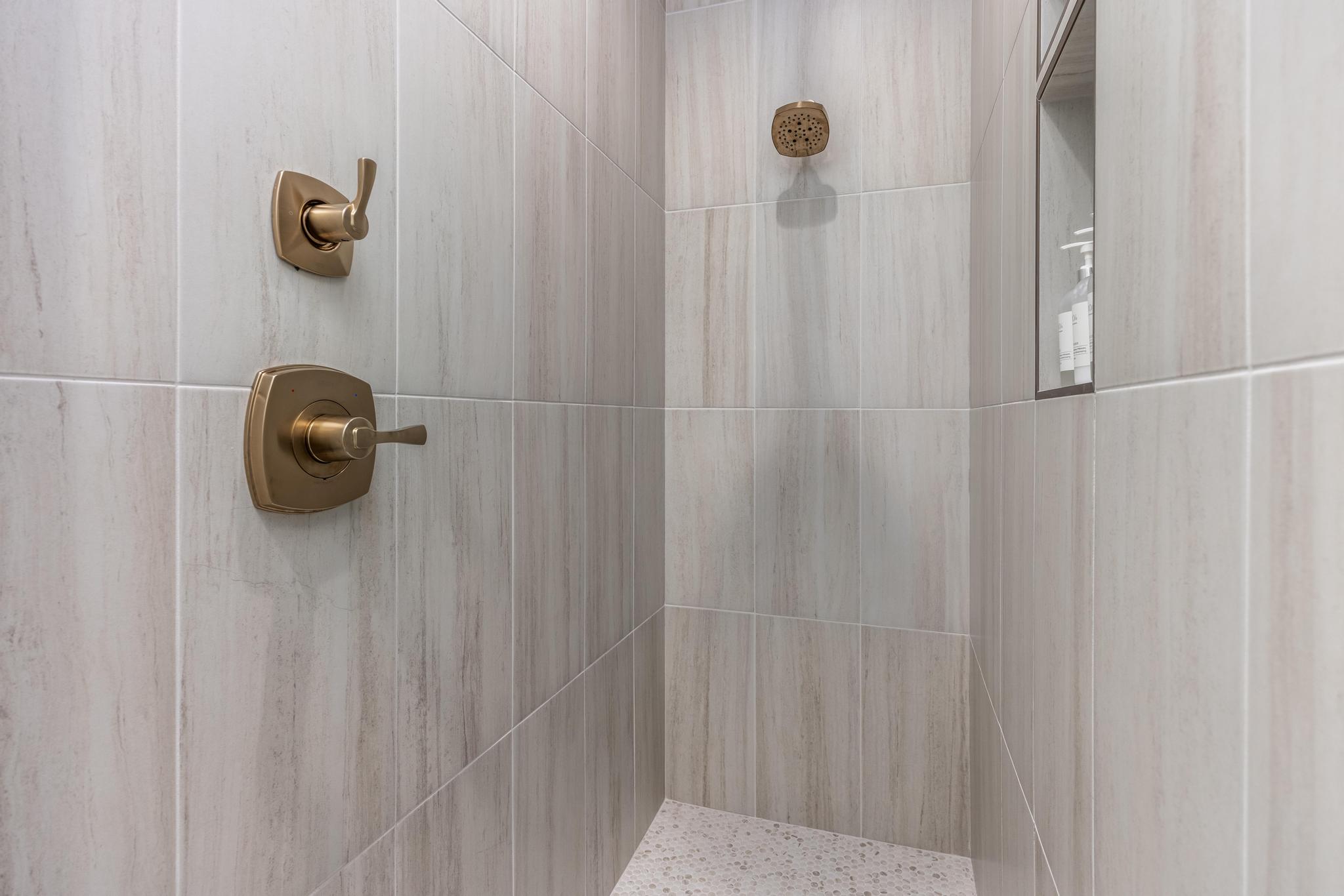 Full bathroom with a tile shower