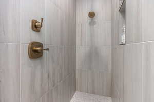 Full bathroom with a tile shower