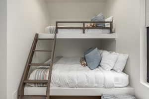 Bedroom featuring vaulted ceiling