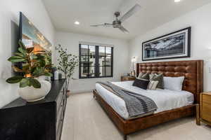 Bedroom with light carpet, recessed lighting, and a ceiling fan