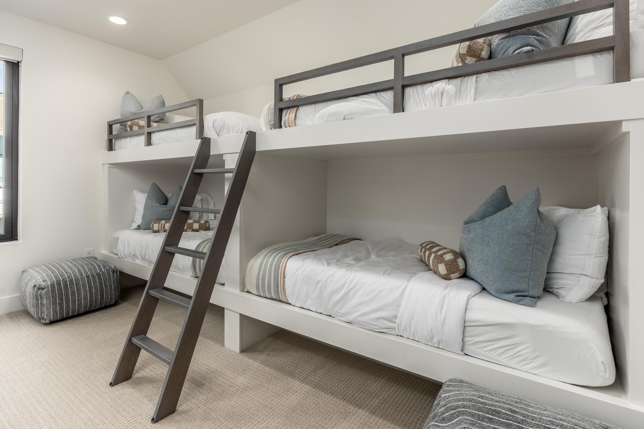 Bedroom featuring light carpet, lofted ceiling, and recessed lighting