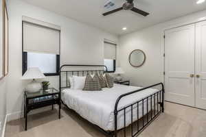 Bedroom featuring light colored carpet, recessed lighting, and ceiling fan