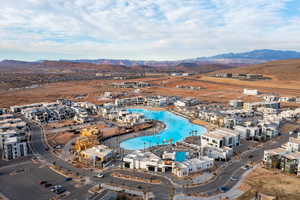 Aerial view of property and surrounding area with a mountainous background