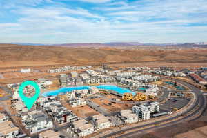 Aerial view of property's location featuring a mountain backdrop