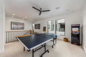Recreation room featuring light carpet, recessed lighting, and a ceiling fan