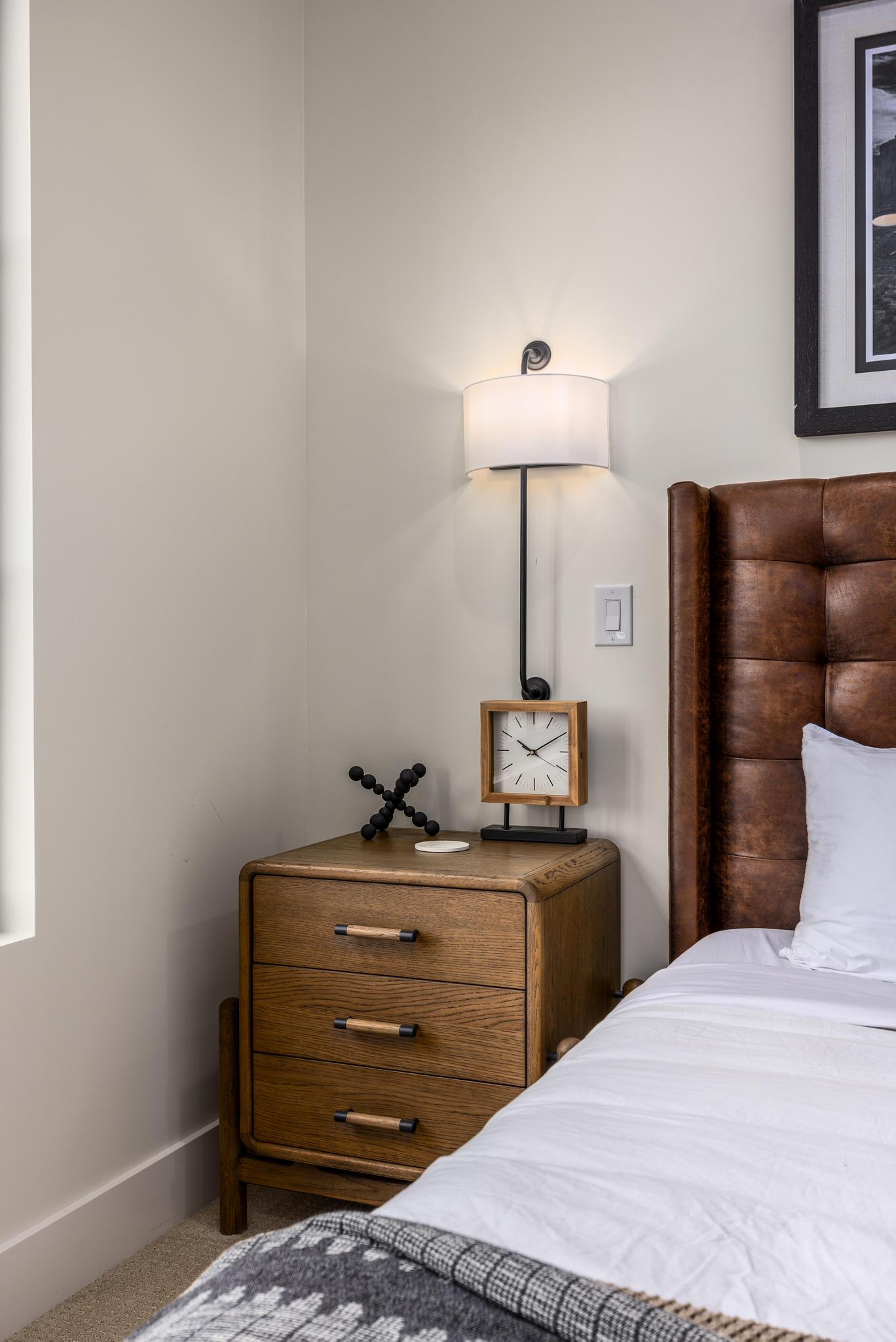 Bedroom featuring carpet floors and baseboards