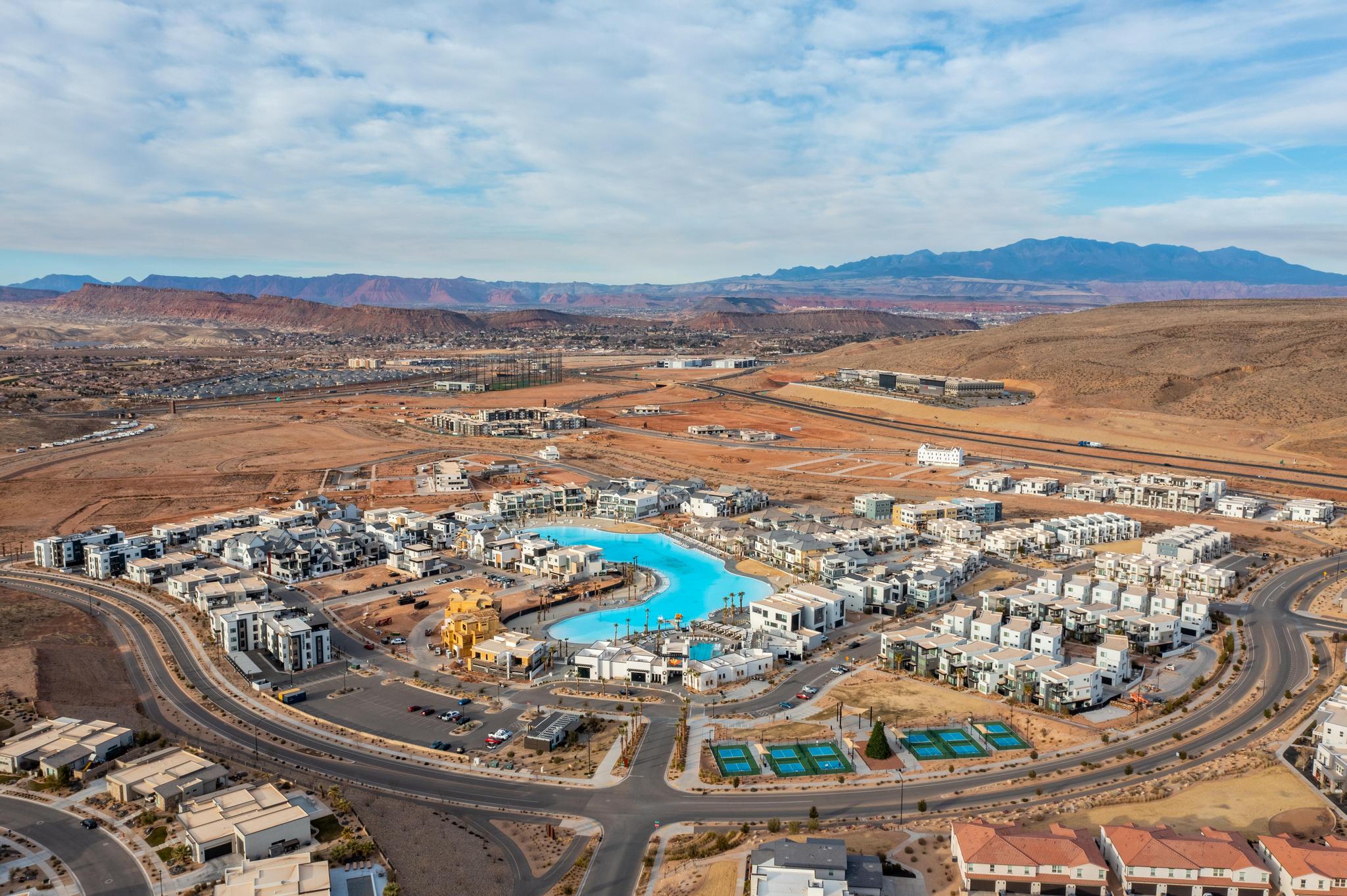 Aerial view of property and surrounding area featuring mountains