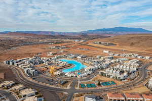 Aerial view of property and surrounding area featuring mountains
