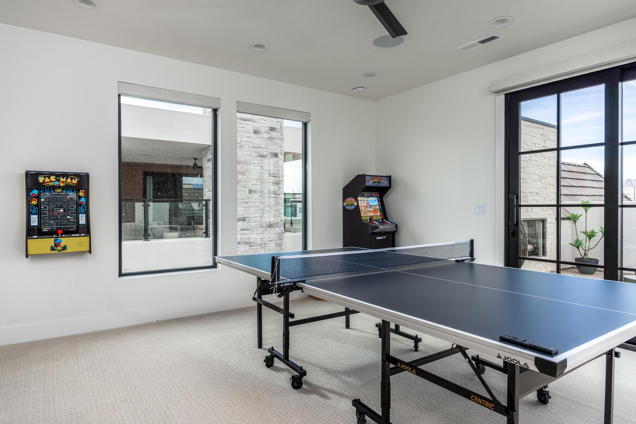 Rec room featuring carpet flooring, healthy amount of natural light, and recessed lighting