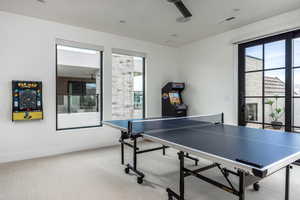 Rec room featuring carpet flooring, healthy amount of natural light, and recessed lighting