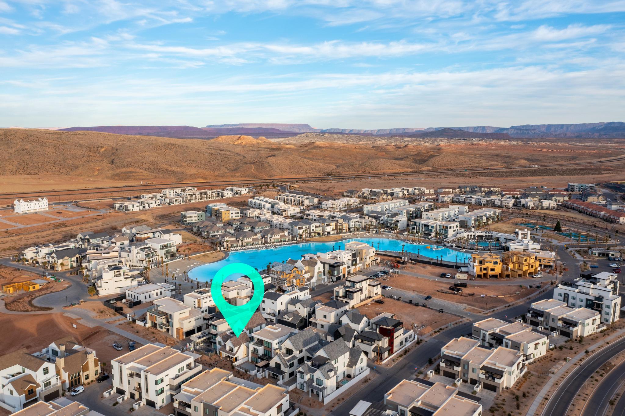 View of property location featuring nearby suburban area and mountains