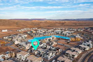 View of property location featuring nearby suburban area and mountains