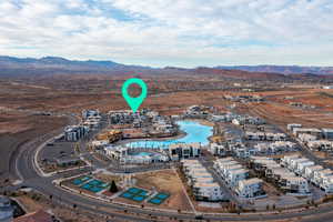 Aerial view of property and surrounding area with a mountain backdrop