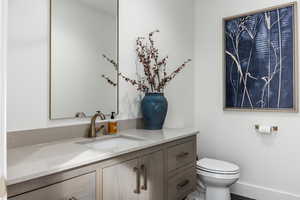 Bathroom featuring vanity and toilet