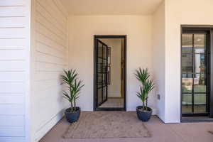 Property entrance with stucco siding