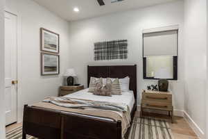 Bedroom featuring light wood-type flooring, recessed lighting, and a ceiling fan