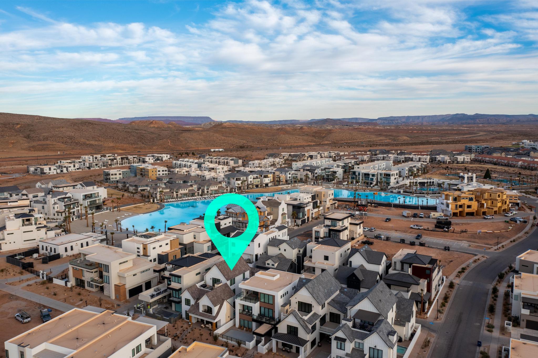 Drone / aerial view of a pool and mountains