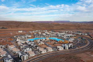 Aerial overview of property's location featuring a mountainous background