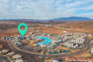 Aerial view of property's location with a mountainous background