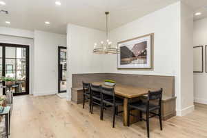 Dining area featuring recessed lighting, light wood-style floors, a chandelier, and breakfast area