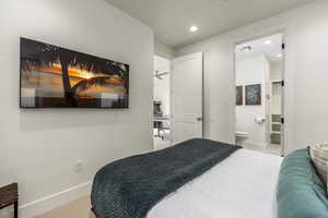 Carpeted bedroom with baseboards and recessed lighting