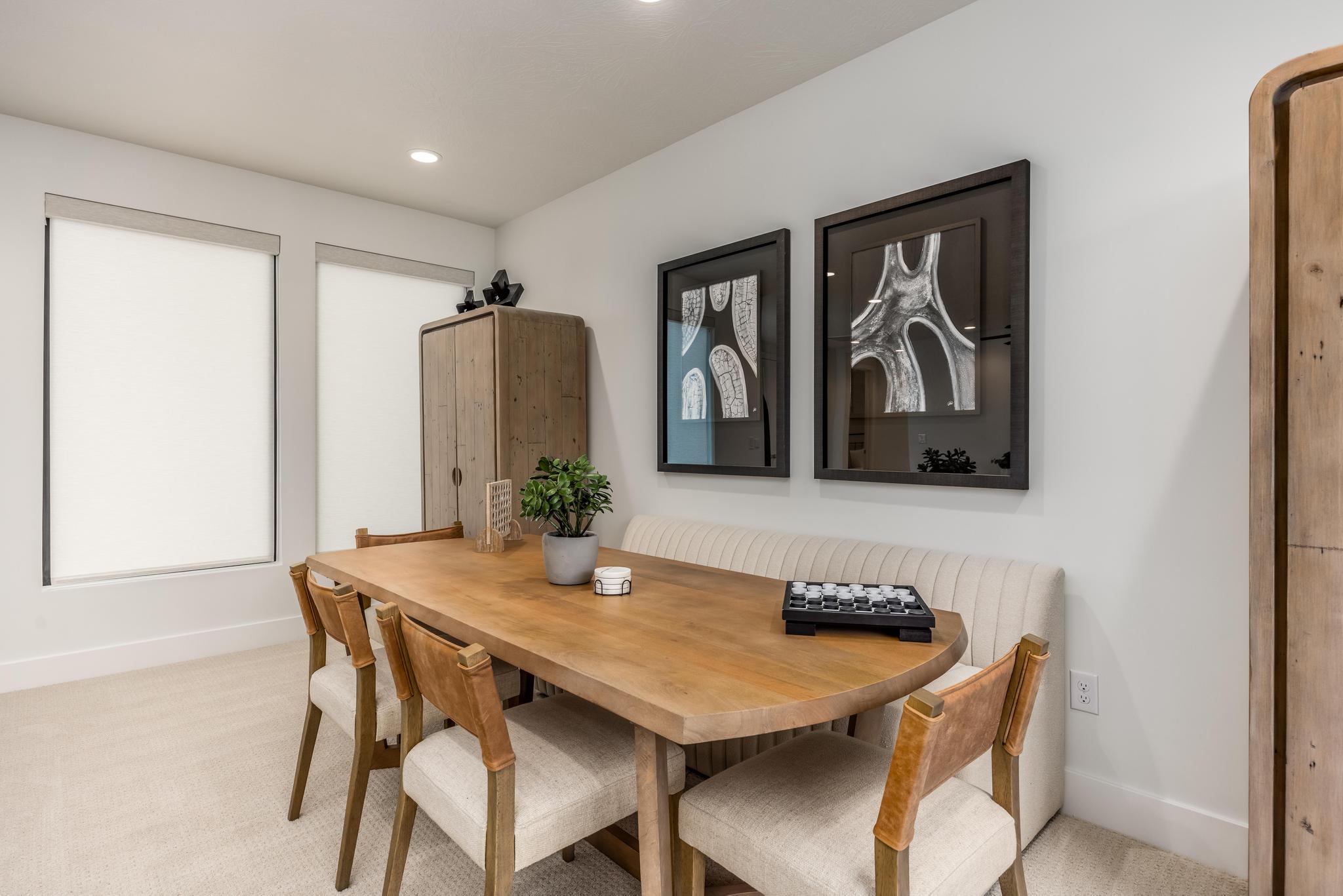 Dining area featuring light carpet and recessed lighting