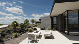 View of patio / terrace with a fire pit