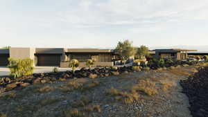 Contemporary house featuring concrete driveway, a garage, and stucco siding