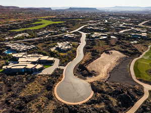 View of property location featuring mountains and a golf course