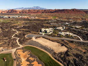 Aerial view of residential area featuring mountains and a local golf course