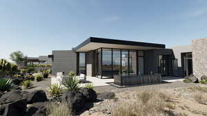 Rear view of property with a patio and stucco siding
