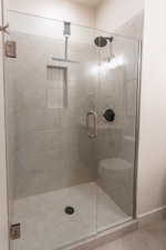 Full bath with a shower stall