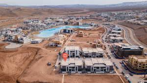 Aerial view of property's location with a mountainous background