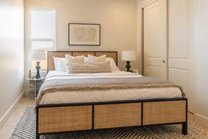 Bedroom with baseboards and light wood-style floors