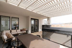 View of patio / terrace with outdoor dining area, a pergola, a hot tub, an outdoor living space, and french doors