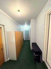 Enclosed mudroom featuring custom storage lockers.