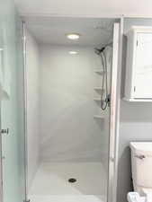 Updated shower in daylight basement bathroom.