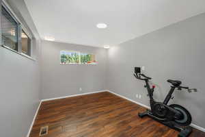 Main-floor bedroom featuring updated paint, lighting, with a wide closet.