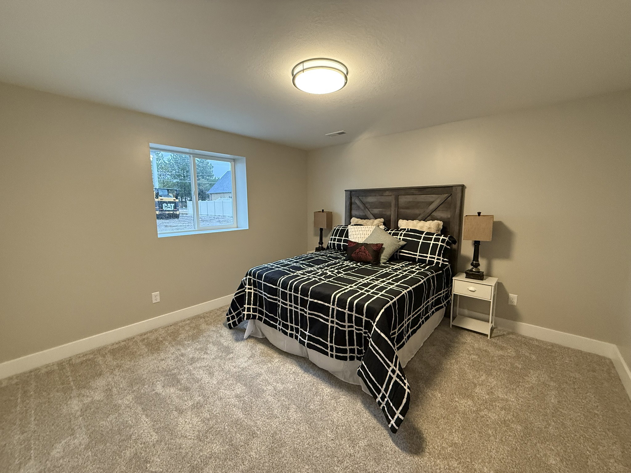 Carpeted bedroom with baseboards