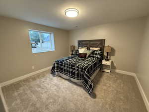 Carpeted bedroom with baseboards