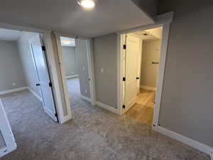 Unfurnished room with light carpet and a textured ceiling